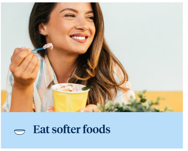 A smiling person eats a soft dessert from a cup with a spoon. The image has a text overlay that reads "Eat softer foods" at the bottom with a bowl icon.