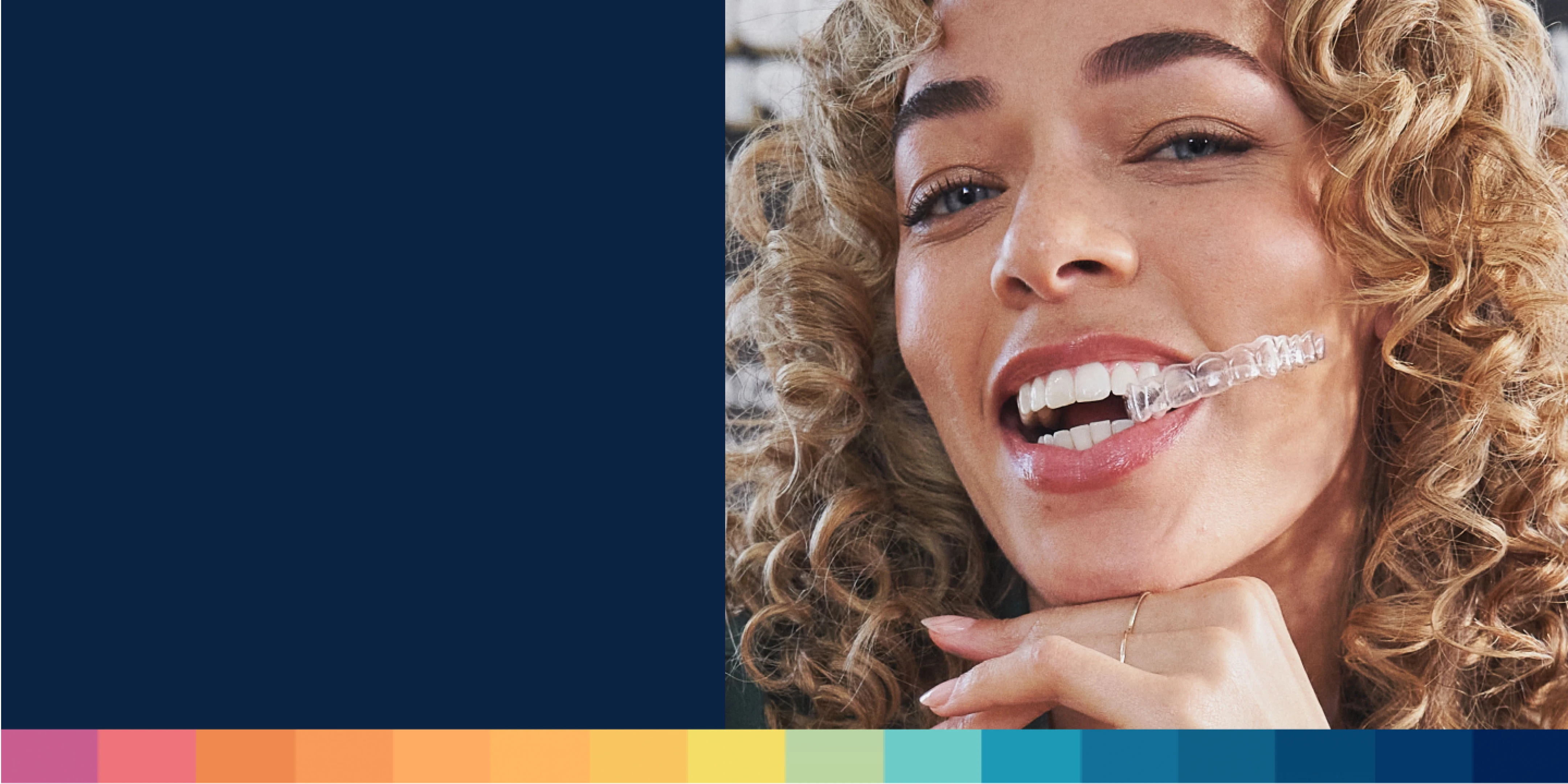 A woman smiles with her Motto Clear Aligners