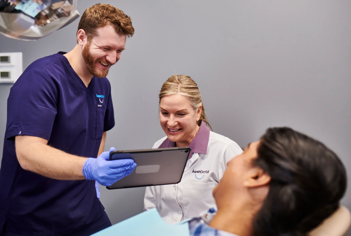 Aspen dental doctors consult with a patient.