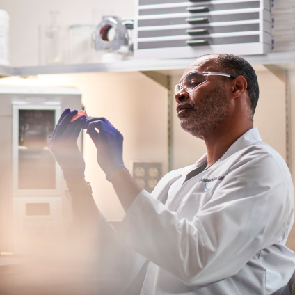 An Aspen Dental doctor looks at dentures. 