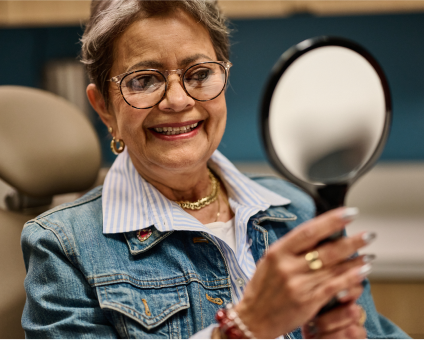 An Aspen Dental veneers patient smiles. 