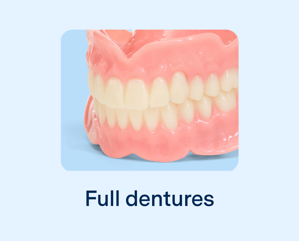 A close-up image of full dentures on a light blue background with the words "full dentures" written on them.