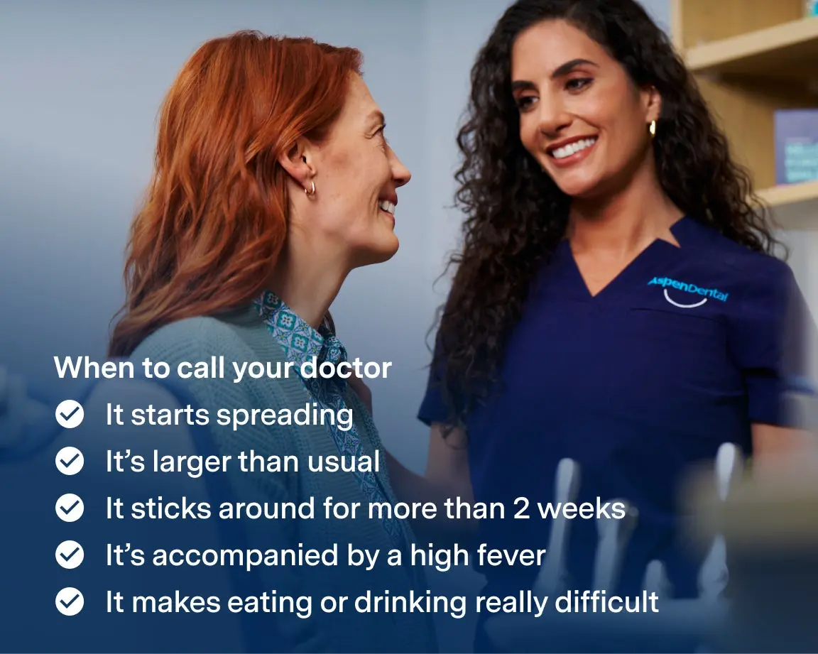 A smiling dental professional speaking with a patient, alongside a checklist of signs indicating when to seek medical attention for a canker sore. Aspen Dental provides expert guidance on identifying severe symptoms and getting the right treatment.