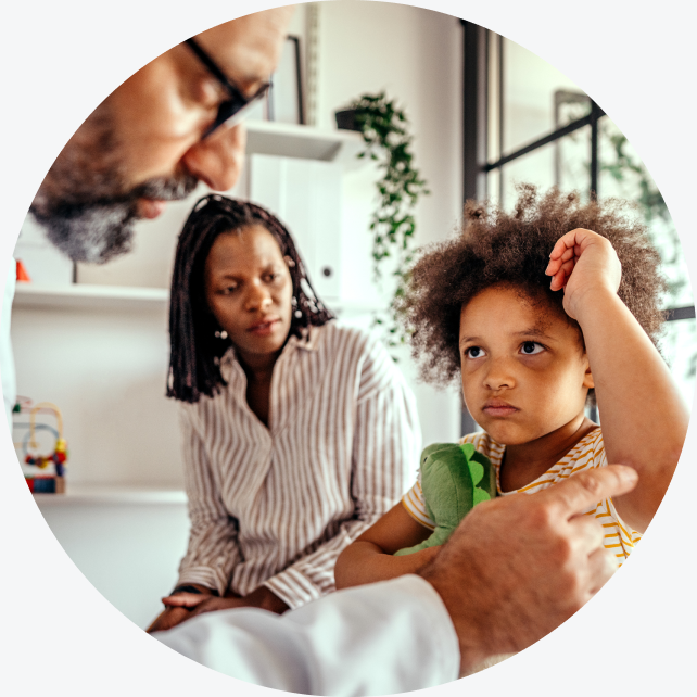 A WellNow doctor examines a child. 