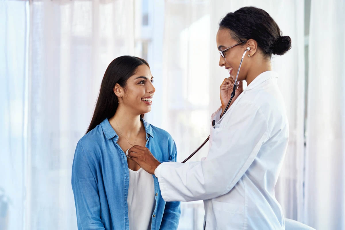 A WellNow Doctor checks the heartbeat of a patient. 