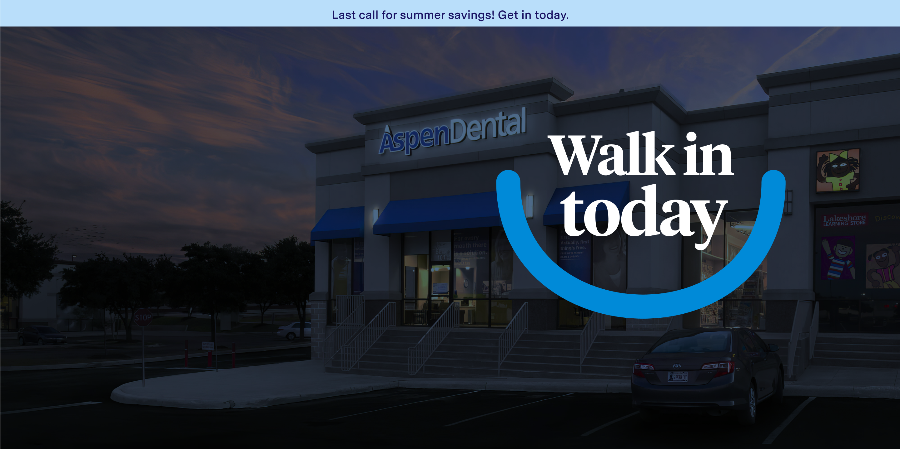 An Aspen Dental storefront at twilight.