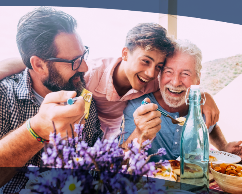 A multigenerational family enjoys a meal together. 