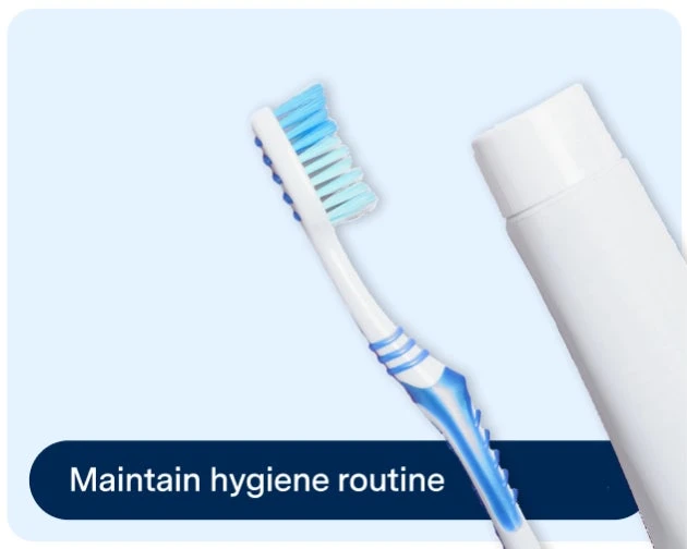 A blue and white toothbrush next to a closed tube of toothpaste on a light blue background with the words "Maintain hygiene routine" at the bottom.