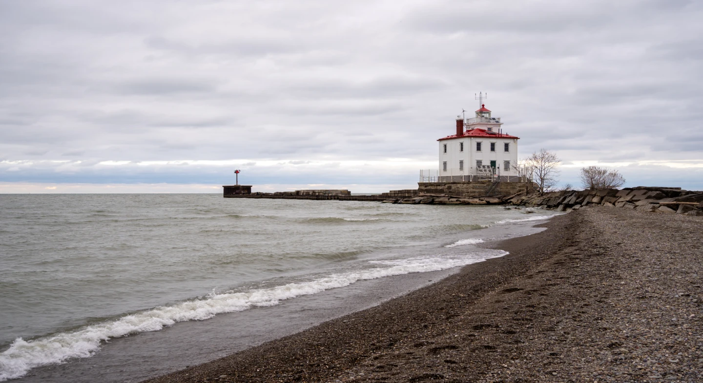 A view of a lighthouse on Lake Eerie on a cloudy day