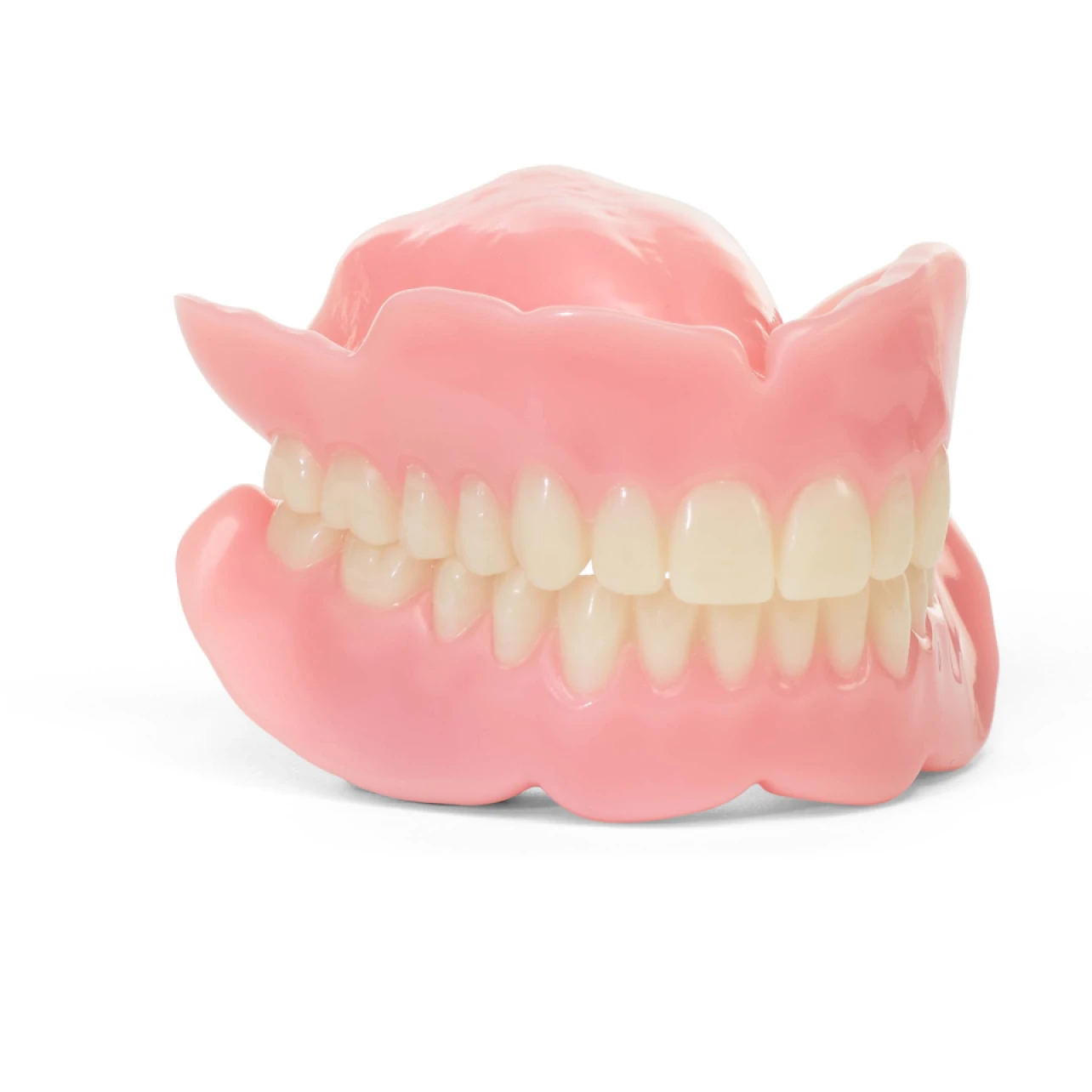 A graphic showcasing a full set of traditional dentures on a white background.