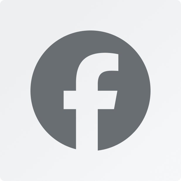 A dark gray Facebook icon on a light gray background