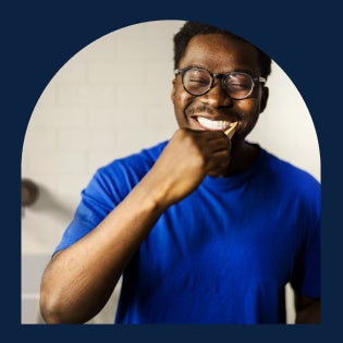 Person brushing their teeth, emphasizing the importance of oral hygiene in orthodontic care.