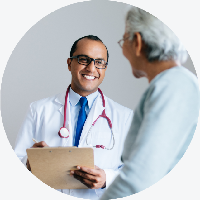 A WellNow doctor smiles. 