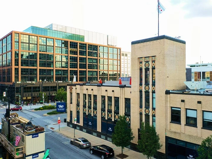 Exterior view of the TAG Oral Care Center for Excellence in Chicago, supported by Aspen Dental, showcasing a modern facility dedicated to advanced oral health services and dental education.