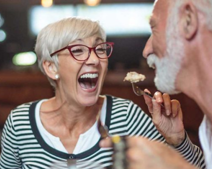 Aspen Dental dentures patients laughing