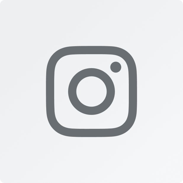 A dark gray Instagram icon on a light gray background