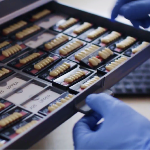 A tray of Aspen Dental dentures. 