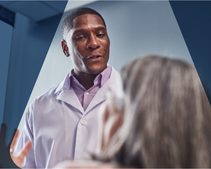 Dentist reviews patient's dental X-rays for comprehensive oral examination.