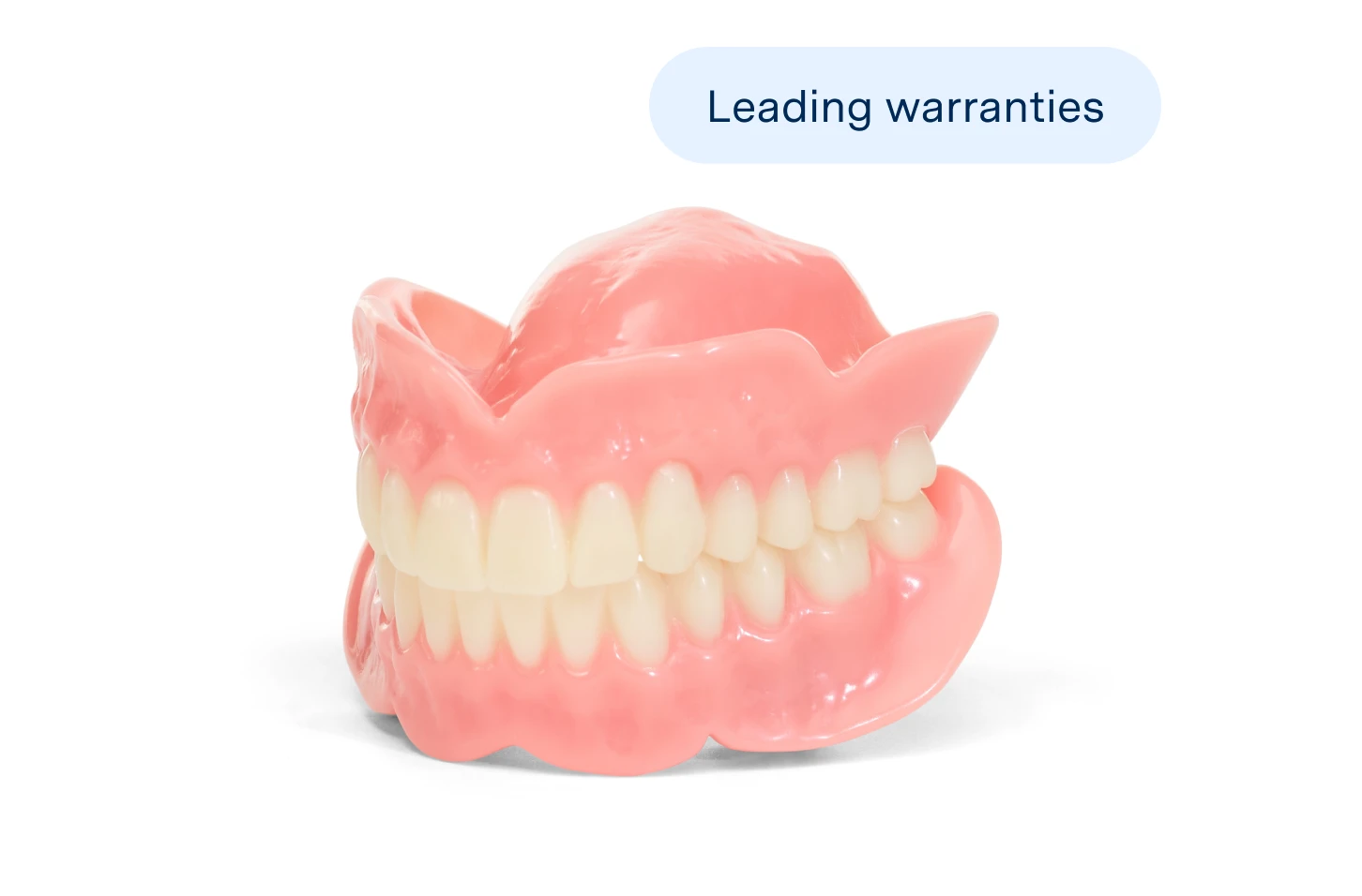 A model of full dentures on a white background with the words 'leading warranties.' Full dentures are a type of denture option available for patients who are interested in a complete arch solution at an affordable price.
