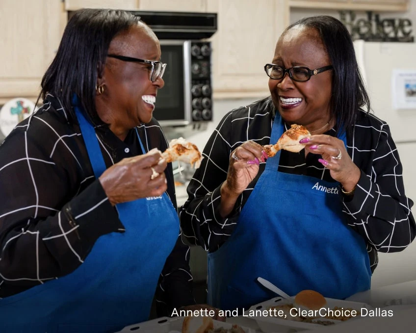 Annette and Lanette, ClearChoice dental implant patients, eating with their new implants.