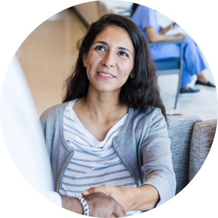 A WellNow patient shakes hands with a doctor. 