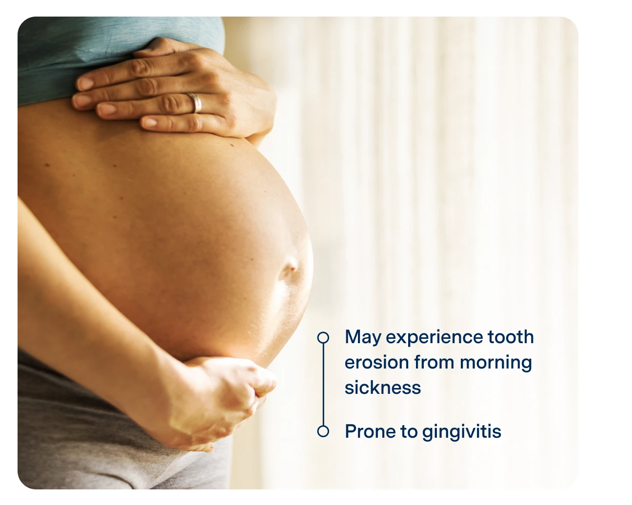 Pregnant person holding their belly, with text noting increased risk of tooth erosion due to morning sickness and prone to gingivitis.