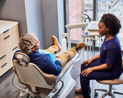 Patient and dentist discussing treatment.