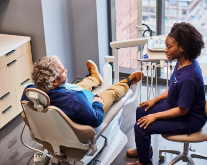 Patient and dentist discussing treatment.