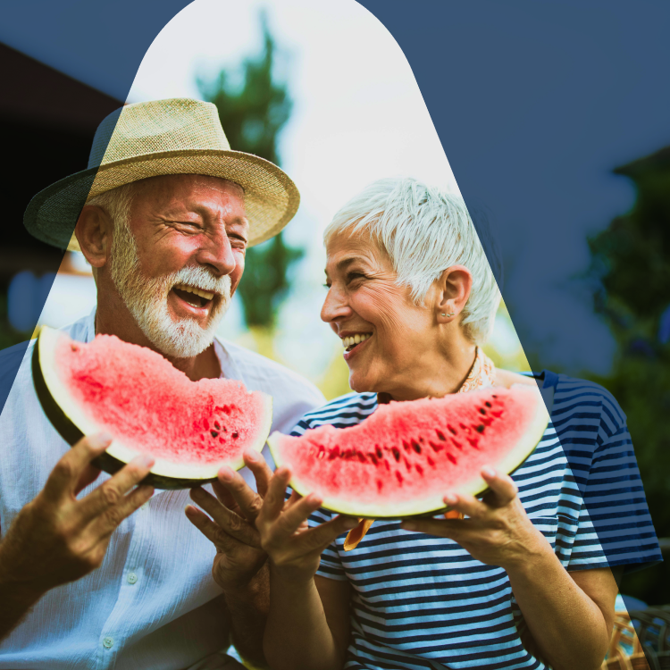 Elderly couple, beaming while looking at each other, their healthy teeth and reflecting excellent oral hygiene. Oral health successfully keep mouth and oral issues like bad breath, mouth sores and spots, and TMJ at bay.