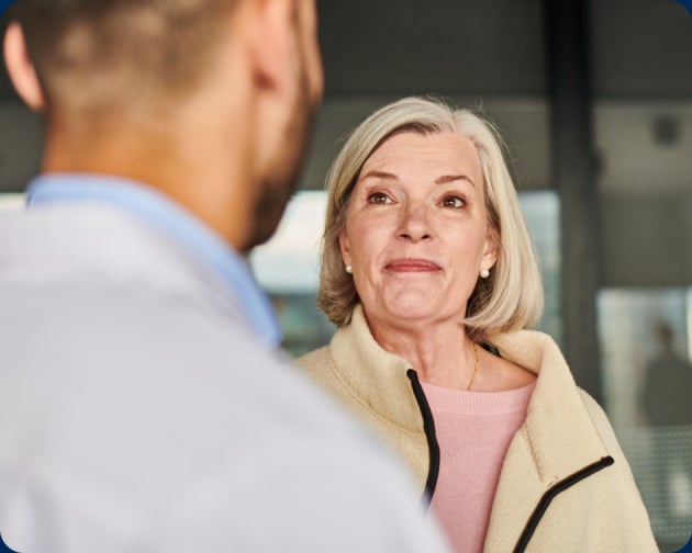 An older woman wearing a light jacket faces a man in a white coat. A text overlay reads "Follow dentist’s instructions" with a number "4" in a teal circle.