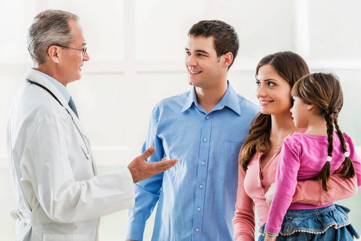 A WellNow doctor speaks with a family. 