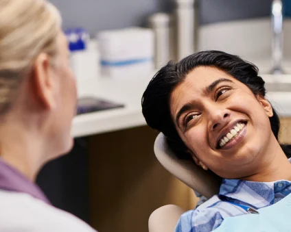 An Aspen Dental patient smiles. 