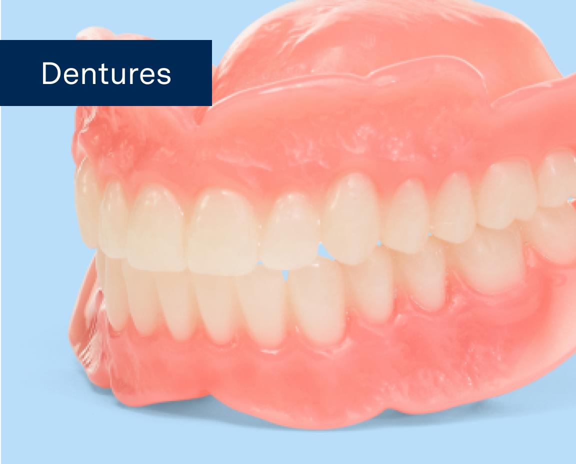 A close-up image of full dentures on a light blue background with the words "Dentures" written on the image.