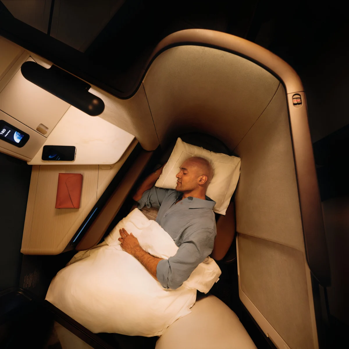 Passenger sleeping in business class. 