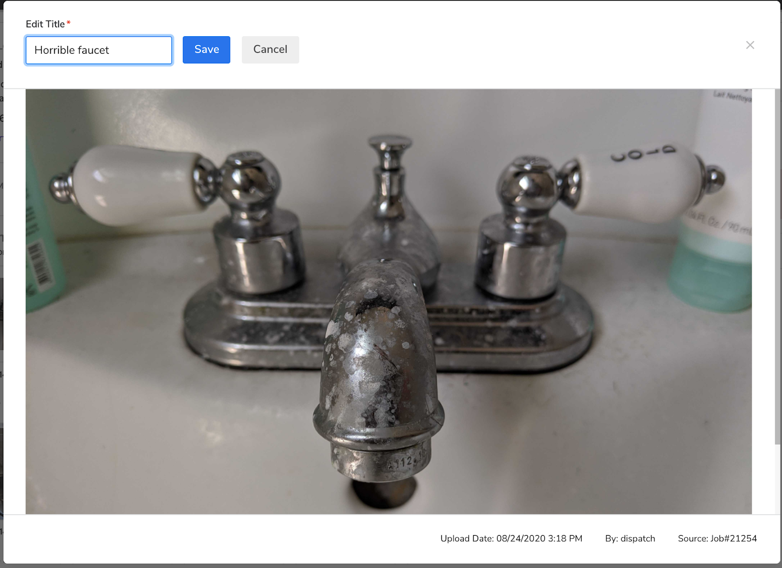 An expanded photo of a sink in poor condition in a ServiceTitan job record.
