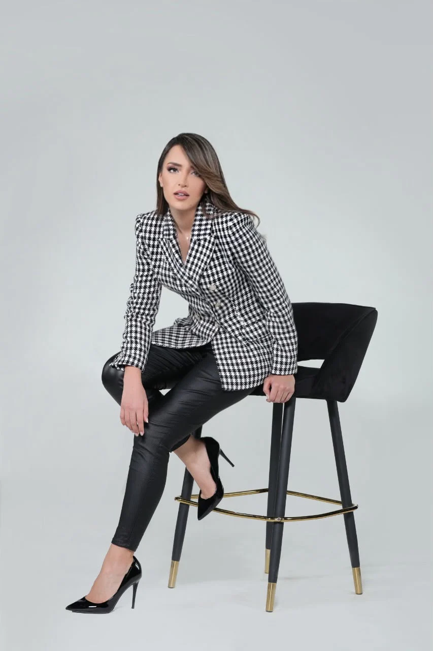 Hasnae Taleb, full-length studio portrait