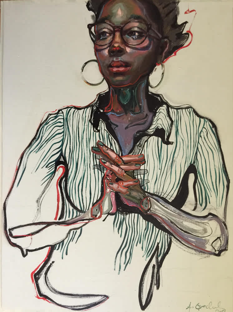 Black woman wearing glasses, hoop earrings, striped shirt and standing with hands clasped together.