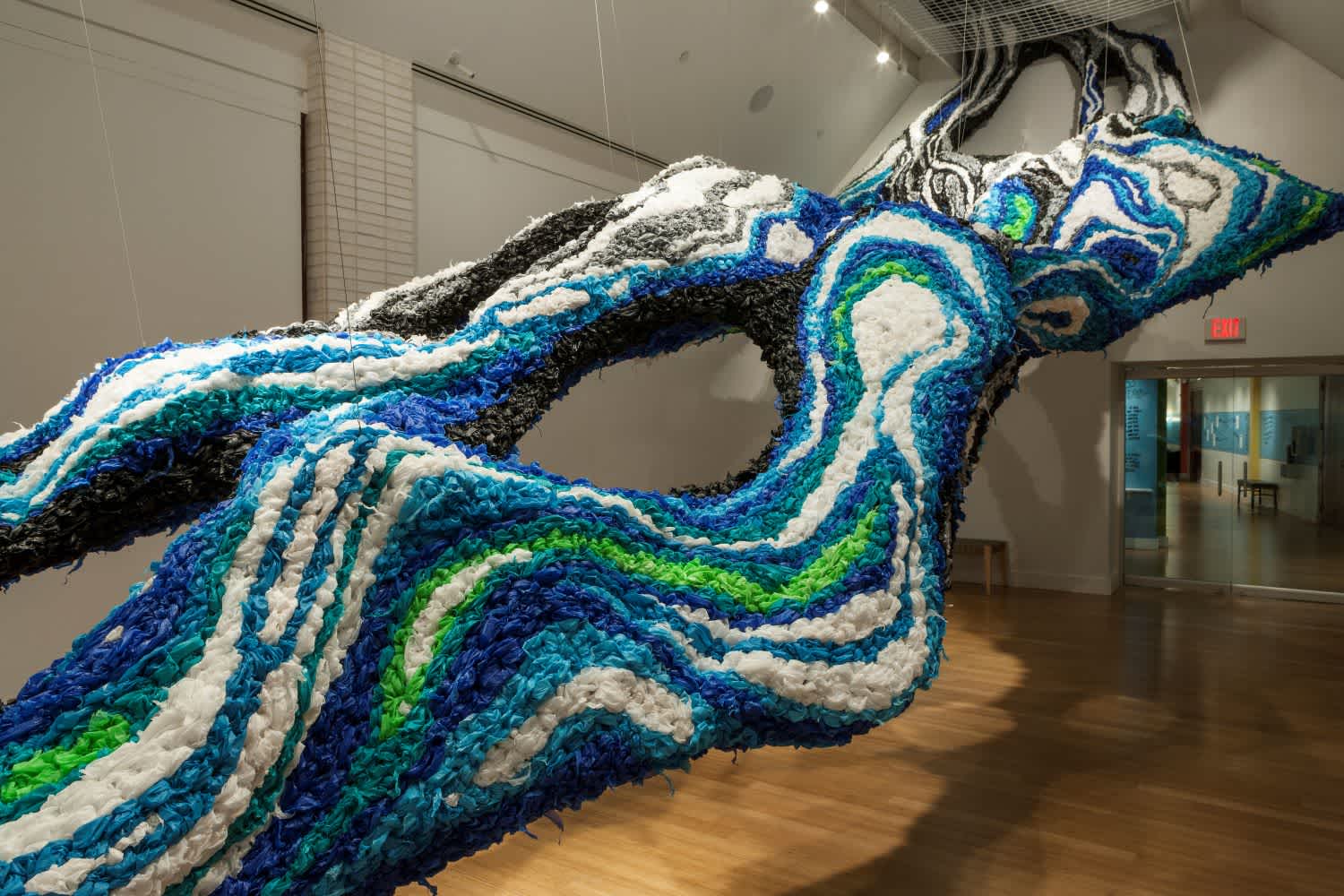 “Alluvion,” a large-scale art installation created by artist Crystal Wagner for her exhibition Surface Tension at Virginia MOCA. She put together her awe-inspiring piece over the course of two weeks, using material like party table cloth and chicken wire.