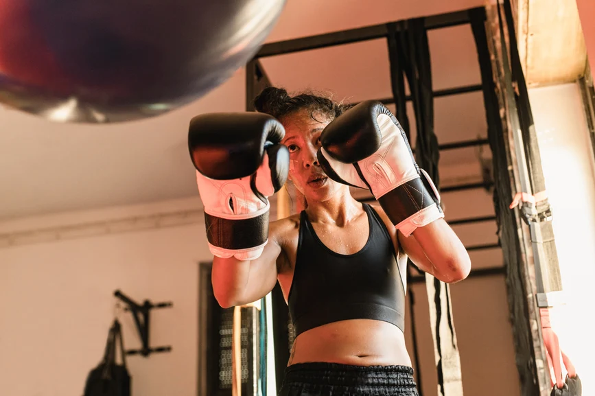 Asian woman boxing with bag for exercise. AW202