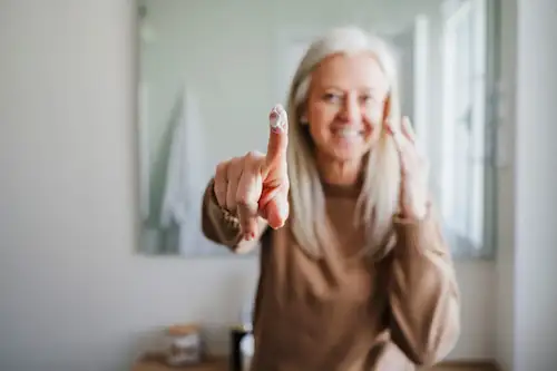 Woman with Skincare on Finger