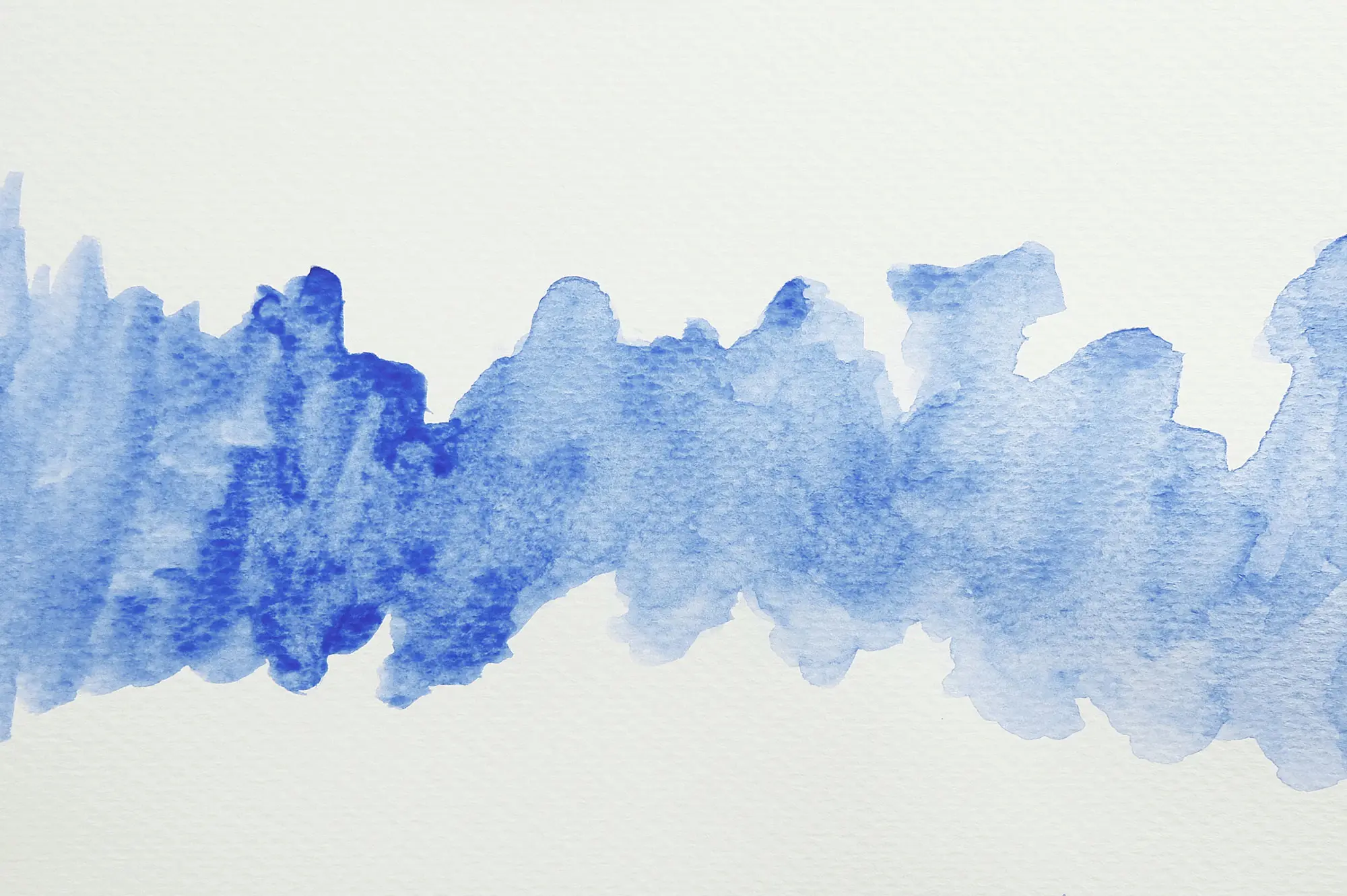 Abstract splotch of light blue watercolor paint on paper. AW488 