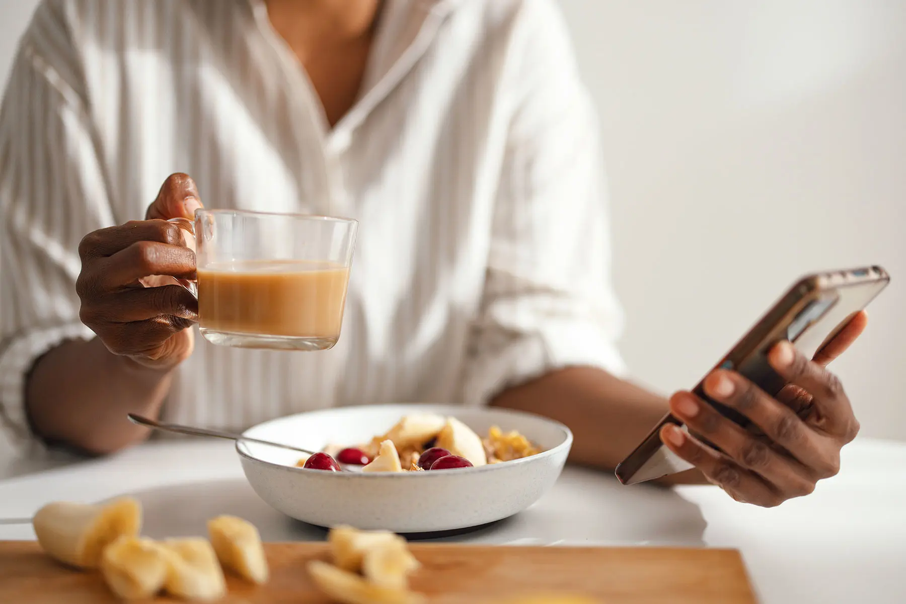 Cropped view of a woman having coffee with her healthy breakfast. header