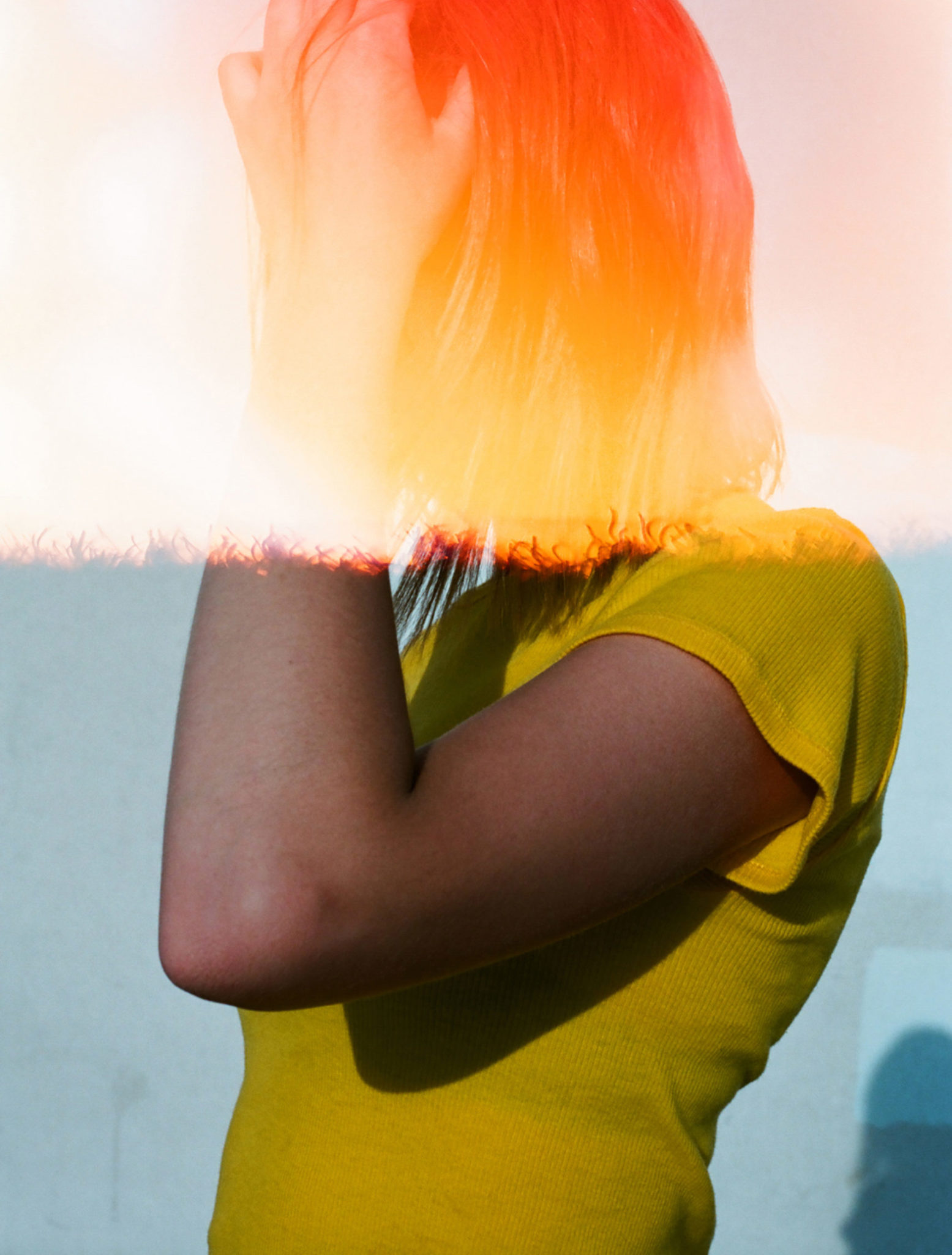 AW126 How Long Do Hot Flashes Last? (1) (film photo with light leaks showing woman with hand on head in profile)