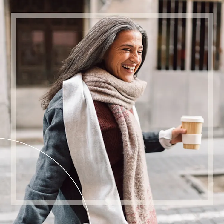 Lady smiling with cup of coffee