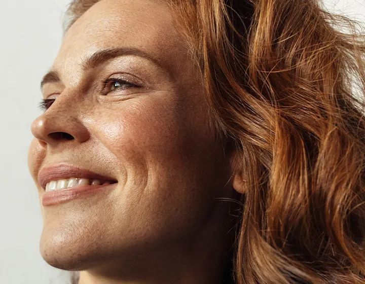 Woman with red hair smiling