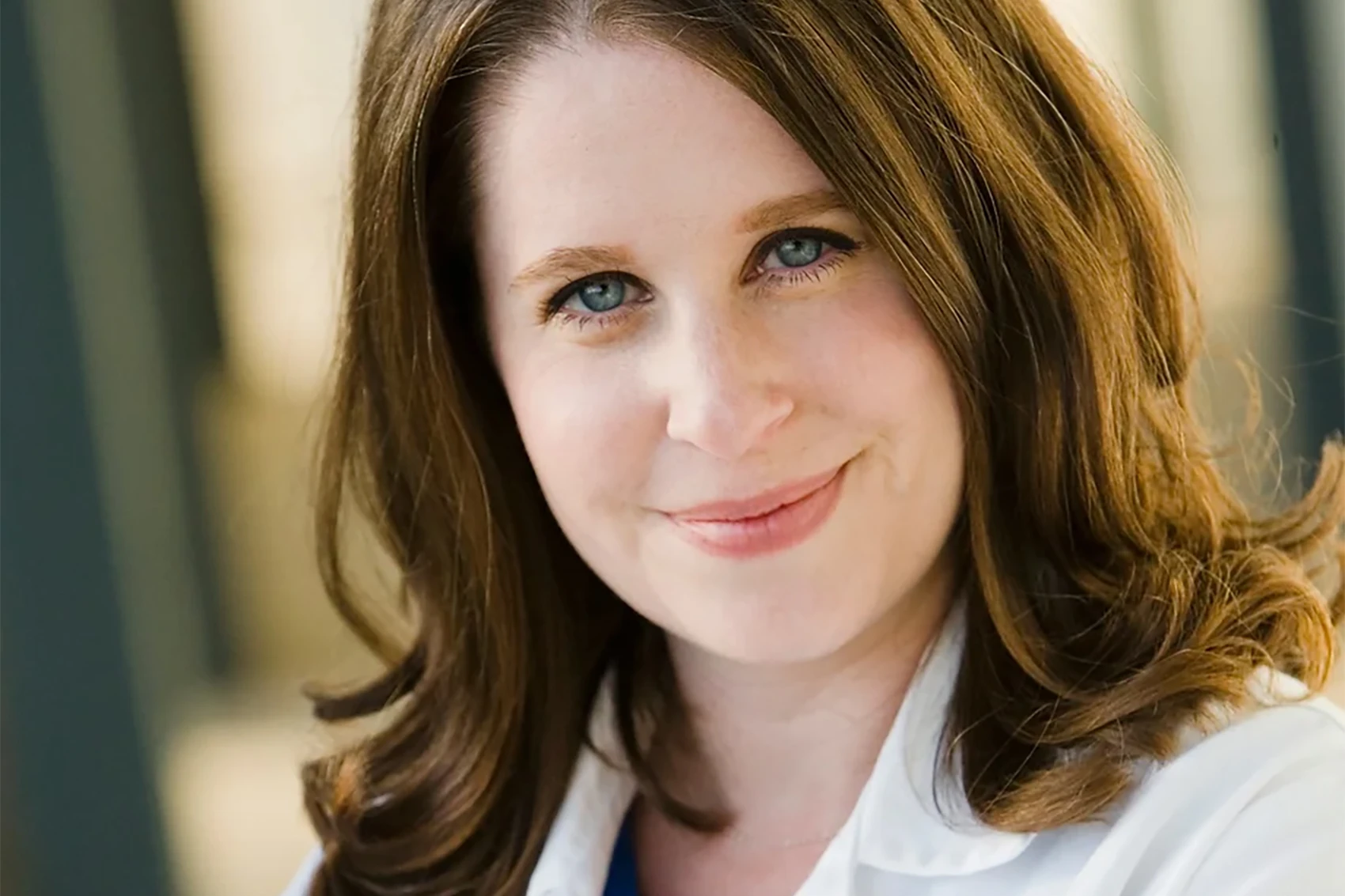 Dr. Rachel Rubin posing in lab coat.
