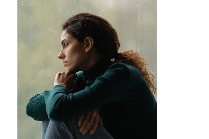 Woman looking at rain