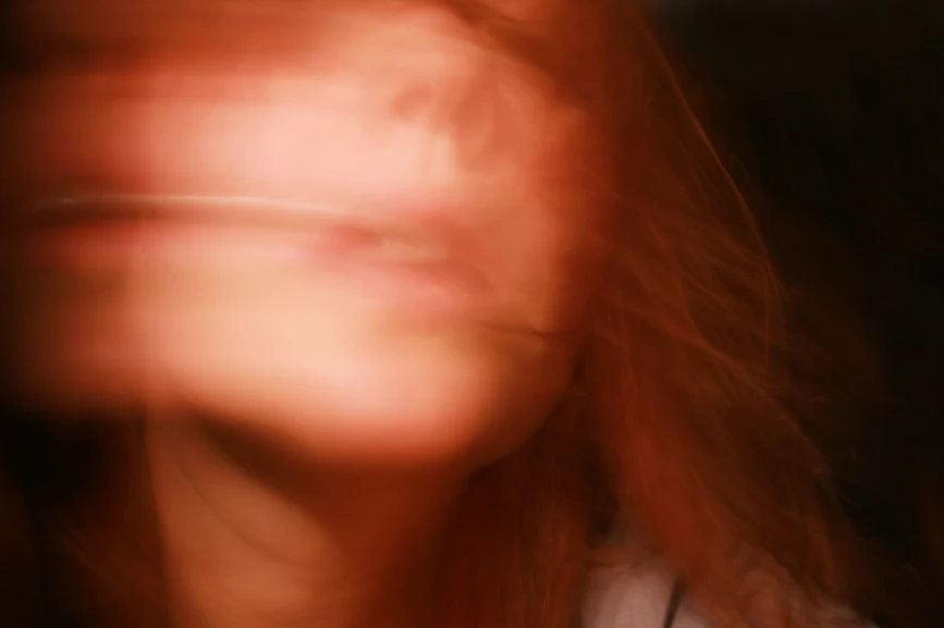 Blurred photo of a woman's face. AW188