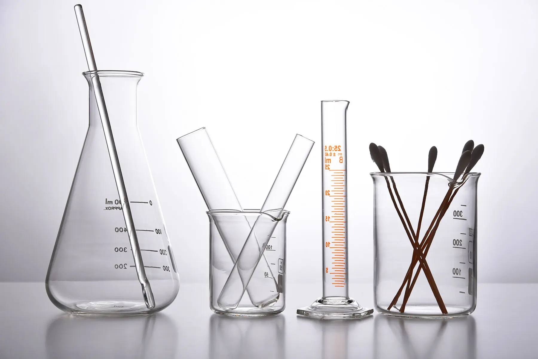 Studio photo of scientific glassware backlit with cotton swabs AW749 header