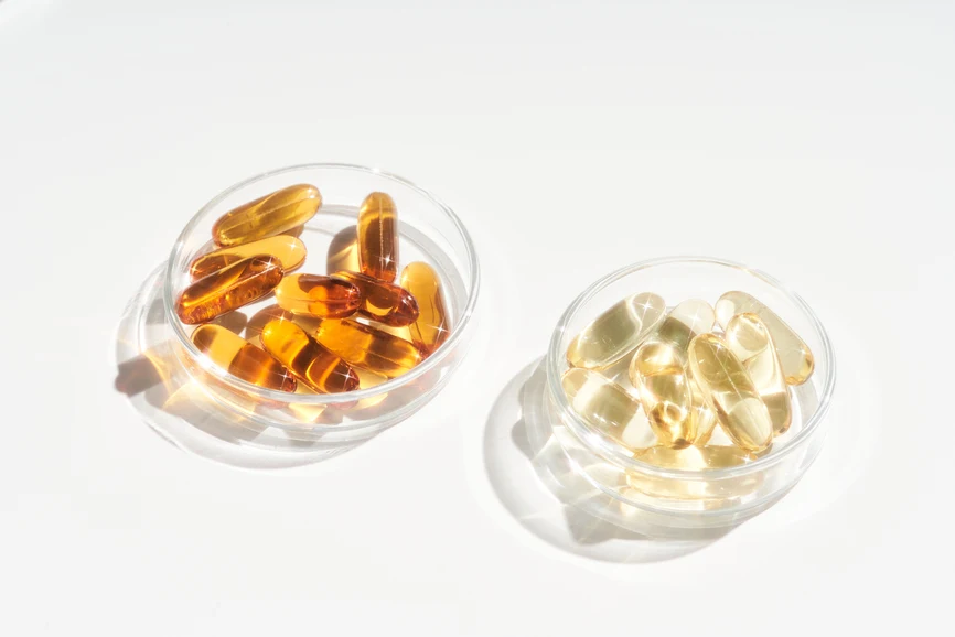 Transparent vitamin pills in glass trays. AW110 